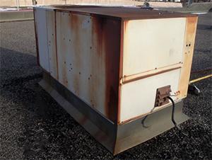 Repair or replace older rooftop HVAC units. Image of old rooftop unit.